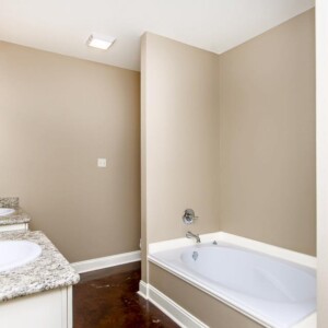 Dual vanities, Garden tub, and shower in the master bathroom