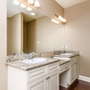 Dual vanities in the master bathroom of the Oak model