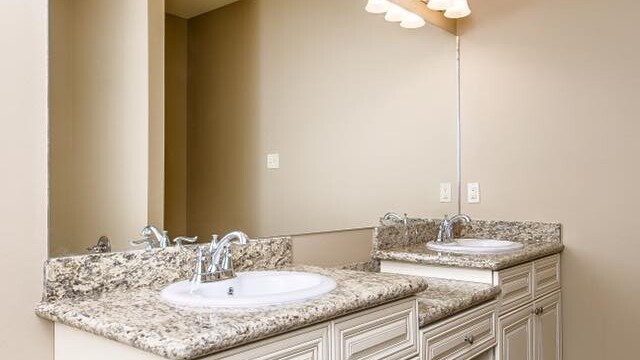 Dual vanities in the master bathroom of the Oak model