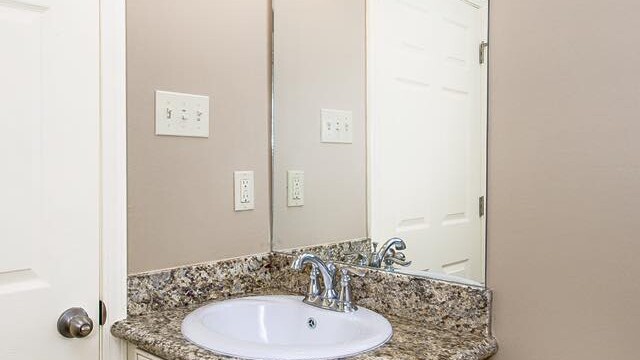 Vanity in the guest bathroom of the Oak model