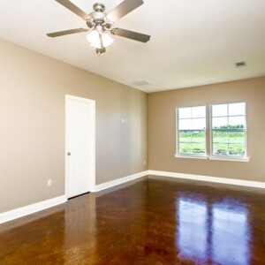 Open floor plan and stained flooring of the Oak model home